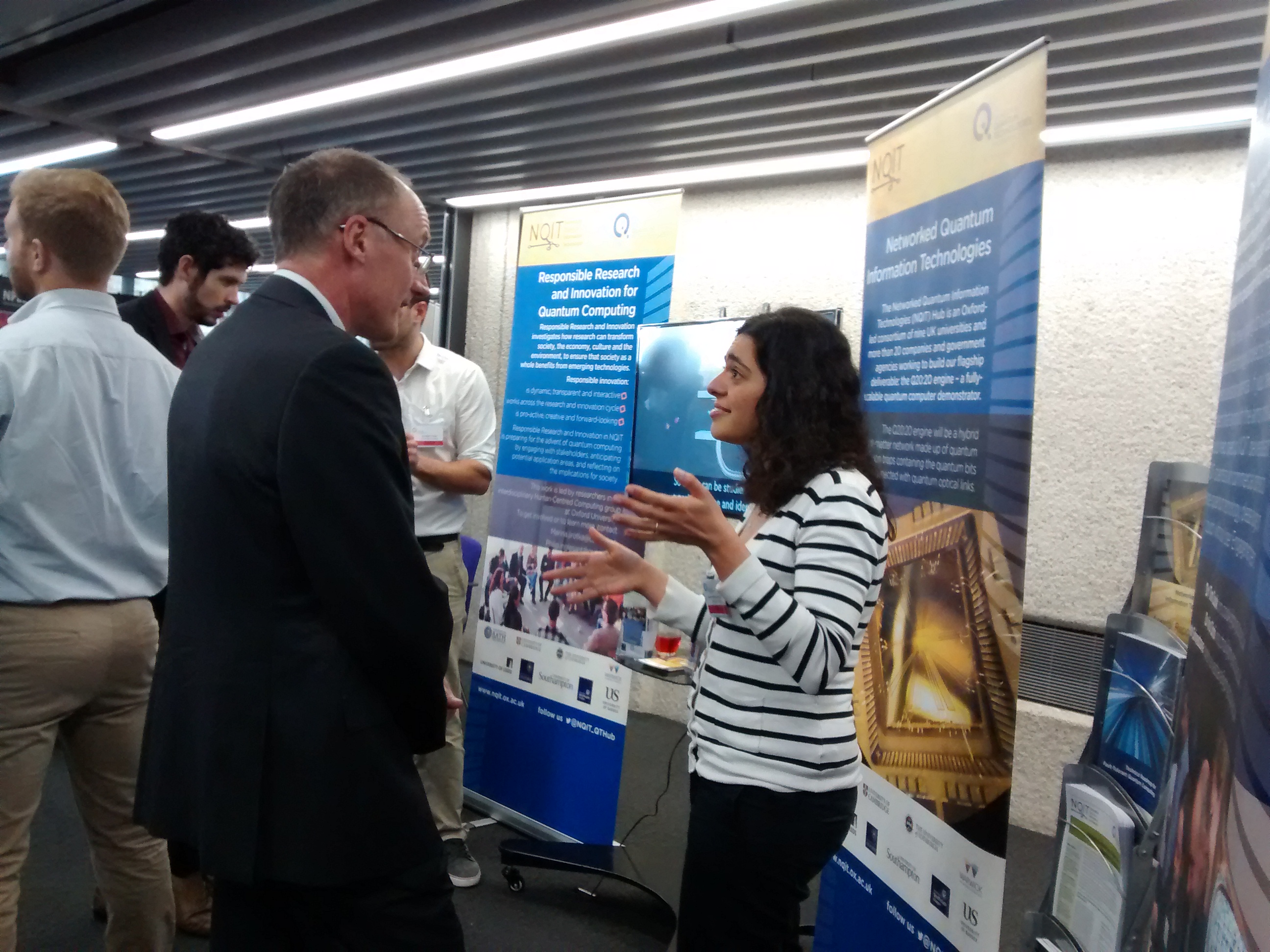 Diana Prado Lopes Aude Craik explains her ion trap research Diana Prado Lopes Aude Craik explains her ion trap research