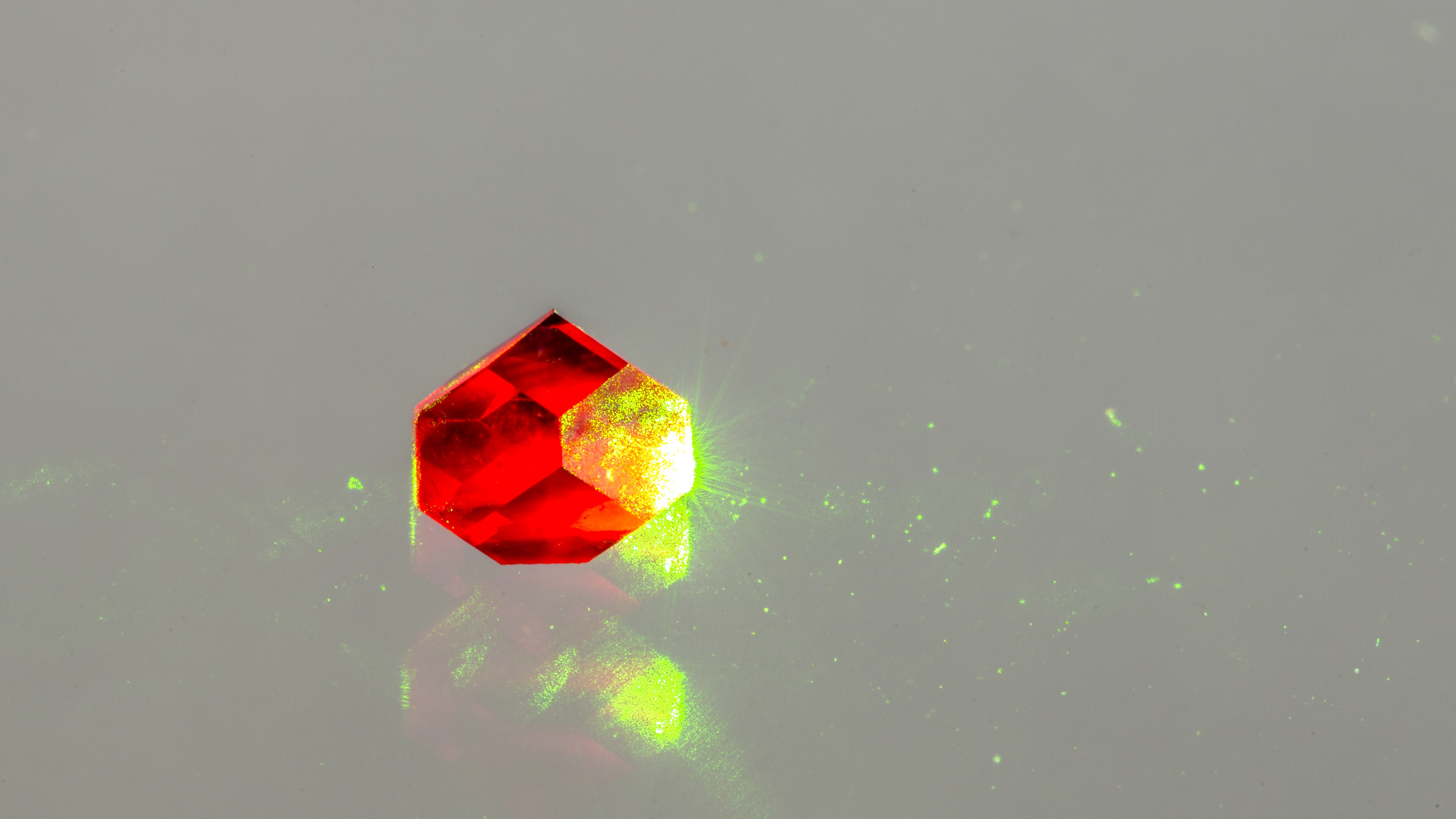 Photograph of diamond containing nitrogen vacancies fluorescing due to illumination with green light. Credit: Jon Newland Photograph of diamond containing nitrogen vacancies fluorescing due to illumination with green light. Credit: Jon Newland